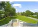 Expansive backyard with a covered patio and lush green lawn, perfect for outdoor enjoyment and relaxation at 1193 River Rd, Johns Island, SC 29455