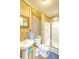 Rustic bathroom with wood paneling, a corner shower, a toilet, and a pedestal sink at 1193 River Rd, Johns Island, SC 29455
