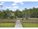 Boardwalk leads to tranquil waterside scenery with an egret standing at the end at 1193 River Rd, Johns Island, SC 29455