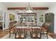The dining room showcases a classic design, with a large wooden table, ornate chairs, and a view into a comfortable living area at 1193 River Rd, Johns Island, SC 29455