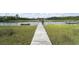 Dock extends over serene waters with lush green marsh grass on each side at 1193 River Rd, Johns Island, SC 29455