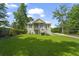 Inviting exterior showcasing the home's well-manicured lawn and the classic architecture with a welcoming porch at 1193 River Rd, Johns Island, SC 29455