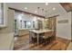 Elegant kitchen featuring a large island with seating, stainless steel appliances, and wood beam accents at 1193 River Rd, Johns Island, SC 29455