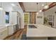 Modern kitchen with a large island, stainless steel appliances, and a rustic barn door at 1193 River Rd, Johns Island, SC 29455