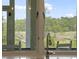 Scenic view from the kitchen window overlooking a marsh, a wooden bridge and natural landscape at 1193 River Rd, Johns Island, SC 29455