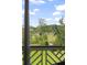 Stunning marsh view, seen from porch railing over lush lawn and featuring a long wooden walkway at 1193 River Rd, Johns Island, SC 29455