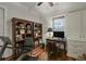Bright office featuring beautiful built-in shelving, desk, and wood floors, offering an elegant workspace at 1193 River Rd, Johns Island, SC 29455
