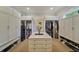 Spacious walk-in closet features built-in shelving, storage cabinets, and central island at 1193 River Rd, Johns Island, SC 29455