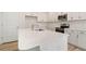 Bright kitchen featuring white cabinetry, stainless steel appliances, and a center island with a quartz countertop at 124 Palfrey Dr, Ridgeville, SC 29472