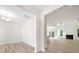 Bright, open-concept living area with hardwood floors, white walls, a fireplace, and ample natural light at 124 Palfrey Dr, Ridgeville, SC 29472