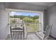Relaxing balcony with seating overlooking scenic neighborhood at 1300 Park West Blvd # 822, Mount Pleasant, SC 29466