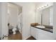 Well-lit bathroom featuring a vanity with a dark countertop and a shower-tub combination at 1300 Park West Blvd # 822, Mount Pleasant, SC 29466