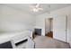 Bedroom with a twin bed, ceiling fan, and access to another room at 1300 Park West Blvd # 822, Mount Pleasant, SC 29466