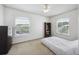 Bedroom with a bookcase, dresser, and natural light from two windows at 1300 Park West Blvd # 822, Mount Pleasant, SC 29466