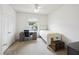 Bright bedroom with a desk, white walls, ceiling fan, and a large window at 1300 Park West Blvd # 822, Mount Pleasant, SC 29466