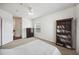 Bedroom featuring neutral carpet, dark bookshelf, white bedding, and bright natural light at 1300 Park West Blvd # 822, Mount Pleasant, SC 29466
