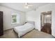 Bedroom with a grey bed, neutral carpet and a light colored wall at 1300 Park West Blvd # 822, Mount Pleasant, SC 29466