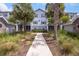 Apartment complex exterior with mature landscaping and walkway at 1300 Park West Blvd # 822, Mount Pleasant, SC 29466