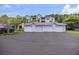 Exterior garages with living spaces above and parking spots in front at 1300 Park West Blvd # 822, Mount Pleasant, SC 29466