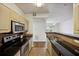 Bright kitchen featuring wood cabinets and stainless steel appliances, open floor plan at 1300 Park West Blvd # 822, Mount Pleasant, SC 29466