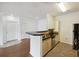 Galley kitchen with breakfast bar and stainless steel appliances open to the living area at 1300 Park West Blvd # 822, Mount Pleasant, SC 29466