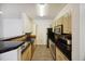 Updated kitchen featuring stainless steel appliances, granite countertops, and tile flooring at 1300 Park West Blvd # 822, Mount Pleasant, SC 29466