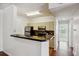 Kitchen featuring a breakfast bar with black granite countertops at 1300 Park West Blvd # 822, Mount Pleasant, SC 29466