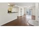 Open living space with hardwood floors and balcony access at 1300 Park West Blvd # 822, Mount Pleasant, SC 29466