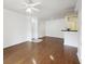 Bright living room with hardwood floors, ceiling fan, and open floor plan to the kitchen at 1300 Park West Blvd # 822, Mount Pleasant, SC 29466