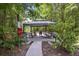 Shaded community pavilion featuring several picnic tables and a charcoal grill at 1300 Park West Blvd # 822, Mount Pleasant, SC 29466