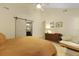 Bedroom view with a large bed and ensuite bathroom featuring a sliding barn door at 1368 Little David Court Ct, Charleston, SC 29412