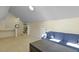 Bonus room with neutral carpet, blue couch, and built-in shelving at 1368 Little David Court Ct, Charleston, SC 29412
