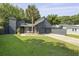 Charming modern home with gray siding, a two-car garage, long driveway and a beautiful palm tree at 1368 Little David Court Ct, Charleston, SC 29412