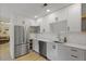 Modern white kitchen with stainless steel appliances, subway tile backsplash, and ample cabinet space at 1368 Little David Court Ct, Charleston, SC 29412