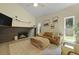 Cozy living room with hardwood floors, fireplace, comfortable seating, and abundant natural light at 1368 Little David Court Ct, Charleston, SC 29412