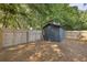 Backyard shed with fenced yard and mature trees at 1368 Little David Court Ct, Charleston, SC 29412