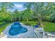 Lush backyard featuring a swimming pool and manicured lawn at 1447 Headquarters Plantation Dr, Johns Island, SC 29455
