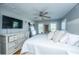 Bright bedroom with a ceiling fan, large windows, and decorative pillows at 1447 Headquarters Plantation Dr, Johns Island, SC 29455