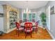 Elegant dining room featuring hardwood floors, wainscoting, and a decorative chandelier at 1447 Headquarters Plantation Dr, Johns Island, SC 29455
