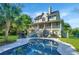 A full backyard view of the house showcasing the exterior of the home and pool area at 1447 Headquarters Plantation Dr, Johns Island, SC 29455