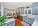 Well-appointed kitchen with gray cabinets, stainless steel appliances, and a cozy breakfast nook at 1447 Headquarters Plantation Dr, Johns Island, SC 29455