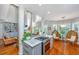 Open kitchen featuring stainless steel appliances, a modern island, and hardwood flooring at 1447 Headquarters Plantation Dr, Johns Island, SC 29455