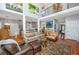 Spacious open-concept living room with high ceilings, hardwood floors, and contemporary furnishings at 1447 Headquarters Plantation Dr, Johns Island, SC 29455