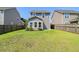 This spacious backyard features a well-maintained lawn with privacy provided by a wood fence at 1484 Milldam Pass, Johns Island, SC 29455