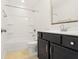 Well-lit bathroom featuring a shower-tub combination and a vanity with a dark wood finish at 1484 Milldam Pass, Johns Island, SC 29455