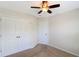 Neutral bedroom features a ceiling fan and a double-door closet at 1484 Milldam Pass, Johns Island, SC 29455