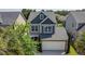 Charming two-story home with a neutral color scheme, complemented by a two-car garage and well-maintained landscaping at 1484 Milldam Pass, Johns Island, SC 29455