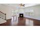 Bright and airy living room with hardwood floors, a fireplace, and views into the dining area at 1484 Milldam Pass, Johns Island, SC 29455