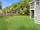 Lush green backyard with privacy fence, mature trees, and well maintained lawn at 1491 Greenshade Way, Mount Pleasant, SC 29464