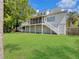 Large home with lush grass, mature trees, deck, porch and privacy fence at 1491 Greenshade Way, Mount Pleasant, SC 29464